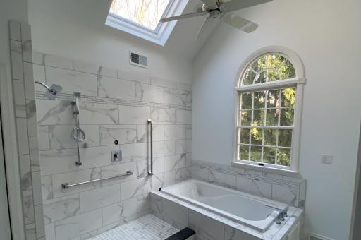 Master bath remodel vaulted ceiling and skylight Stunning sunlit master bath remodel
