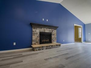 Family room with fireplace and vaulted ceiling